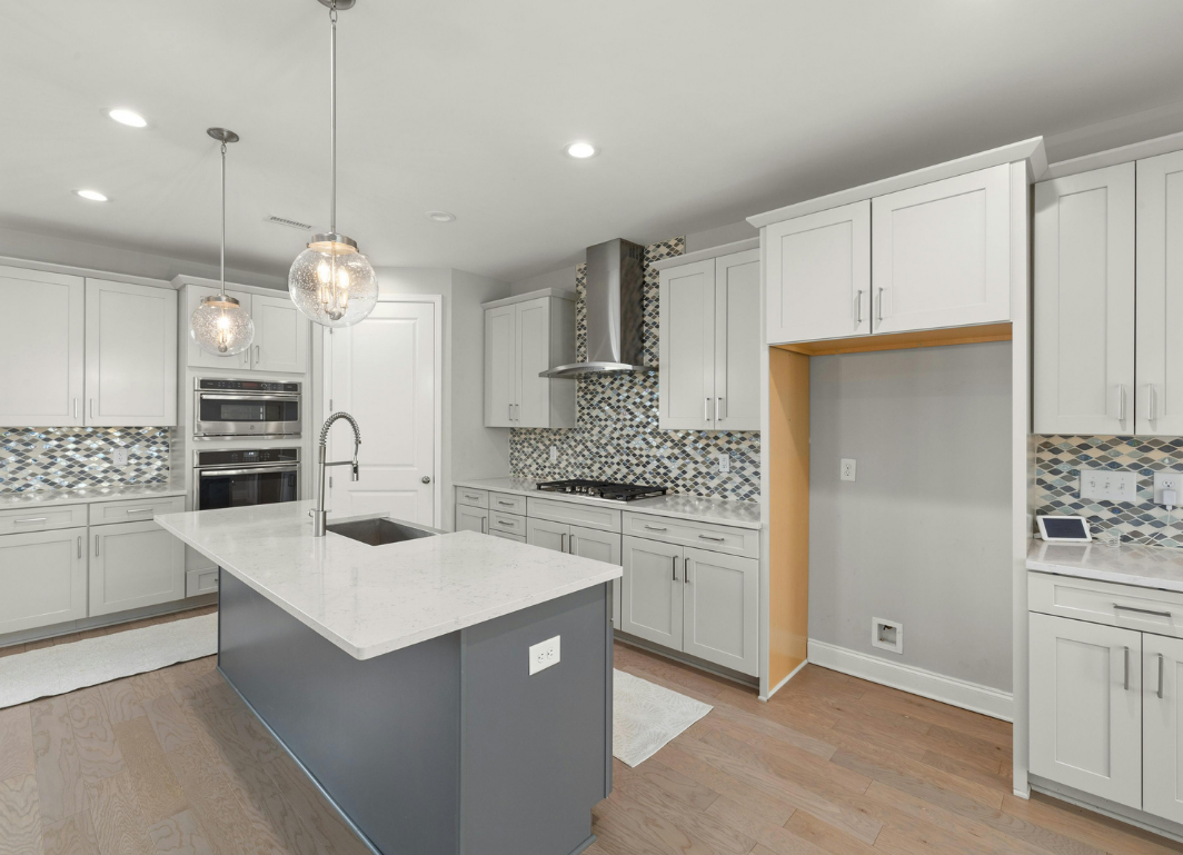 Fitted kitchen, wide hero shot, painted shaker with island